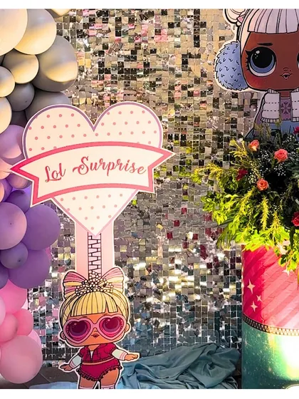 A close-up of the 'LOL Surprise' themed decor, featuring a glittering sequin backdrop that makes every photo sparkle. We work with top decorators to create the perfect photo setting.
