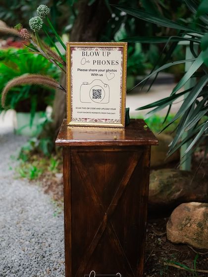 An interactive "Blow Up Our Phones" corner, encouraging guests to share their photos from the day via a QR code.