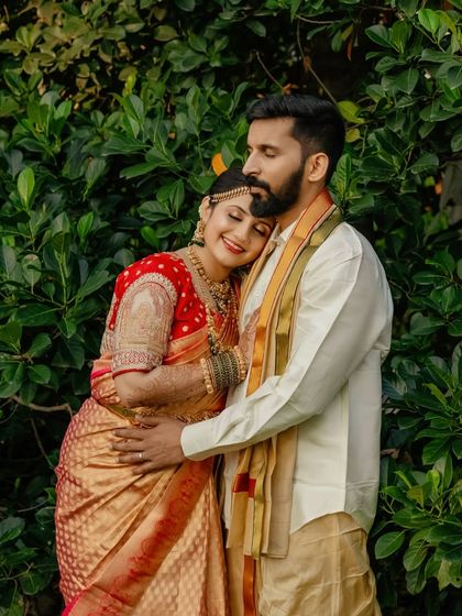 A tender moment between the bride and groom. Her makeup is soft and romantic to match the mood.