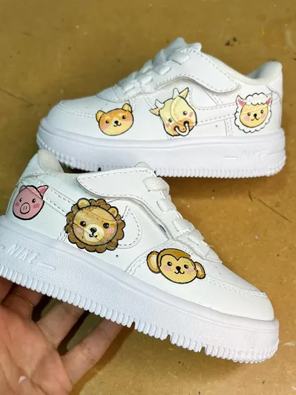 These custom kids' Nike AF1s are covered in adorable, hand-painted cartoon animals. A super cute and personal gift.