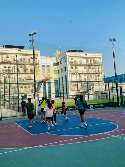 A player jumps high for a shot, showing great athleticism.