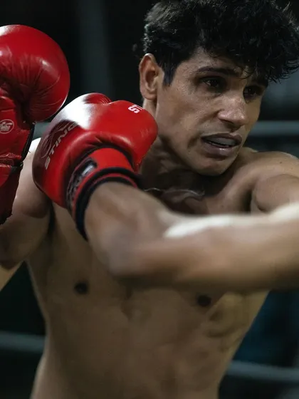A close-up of a fighter in motion. Every punch is a result of hours of training, sweat, and dedication.