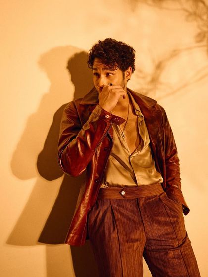 A wider shot of Siddhant's Filmfare look, showing how the different brown tones and textures work together to create a cohesive and stylish outfit.