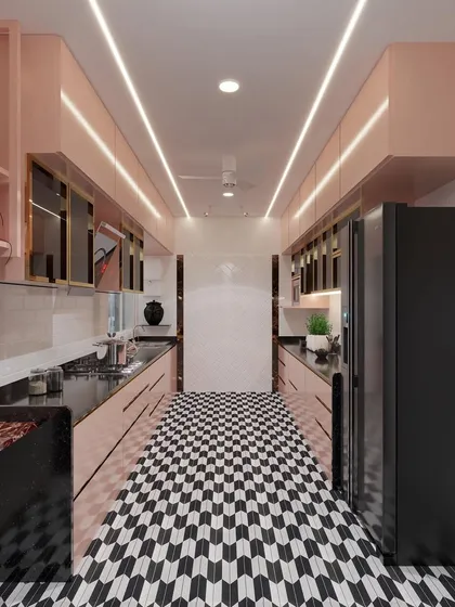 This kitchen design shows how we can play with color and pattern. The bold black and white geometric flooring is balanced by soft baby pink cabinetry, creating a look that is both chic and unique. I designed this parallel kitchen layout for maximum efficiency, with sleek, handleless cabinets and integrated lighting for a clean, modern finish.