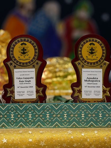 The plaques honoring the Chief Guest and Guest of Honor at the Sacred Hearts Alumni Meet.