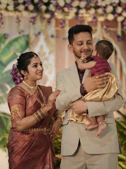 Another sweet moment from the cradle ceremony, capturing the love and joy of the new parents and their baby.