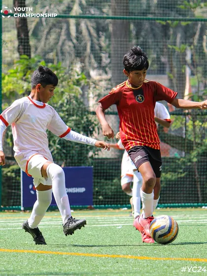 The intensity of a one on one battle during a Youth Championship match. We thrive on competition, and every game is a chance for our players to test their skills and determination.