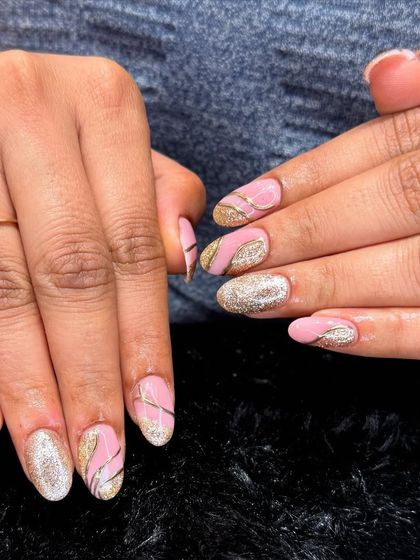 A soft and glamorous look perfect for any celebration. This design pairs a gentle pink base with sparkling gold glitter accents and delicate silver line work.