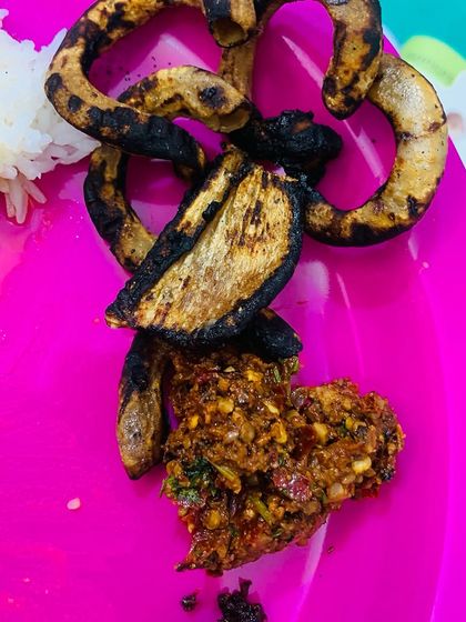 A close up of the crispy roasted pork intestine and a spicy chutney.