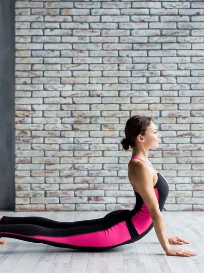The Cobra Pose, or Bhujangasana, provides a gentle stretch to the abdominal muscles and can help stimulate liver function. This image shows the classic execution of this rejuvenating backbend.