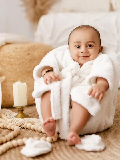 A fun and unique 'spa day' theme for a 3-month-old, complete with a tiny bathrobe. We love getting creative with our milestone sessions.