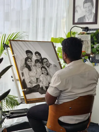 Here I am with the completed 75-hour family portrait. It’s a privilege to spend so much time with my subjects, even if just through photos, getting to know their faces and bringing them together on paper from my Bangalore studio.