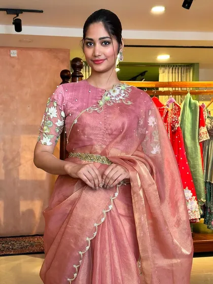 Here is a complete look from my 'Kamalam' collection, inspired by the serene beauty of the lotus flower. This elegant pink tissue organza saree features delicate scallop edges and is paired with a blouse showcasing intricate floral embroidery on the sleeves and neckline. It’s a perfect example of how a simple inspiration can become a sophisticated and modern statement.