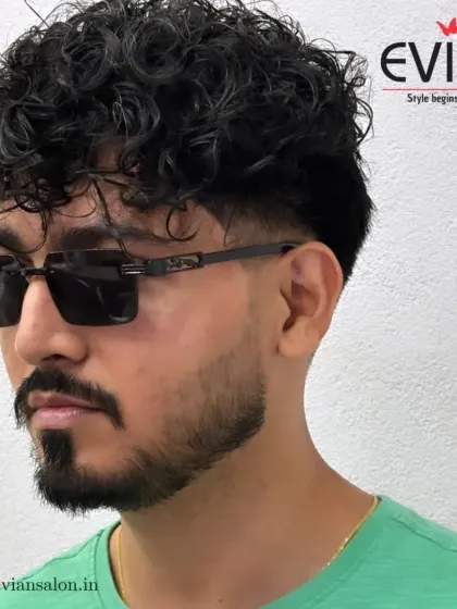 A great haircut is a statement. For this client, I created a modern, stylish look with defined curls on top and a sharp skin fade on the sides. This men's haircut is all about texture, shape, and confidence.