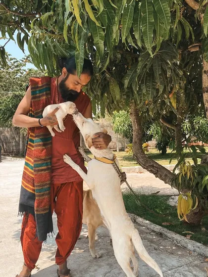 I share a tender moment with our ashram dogs. Our connection to all living beings is a practice of love and compassion that we live every day.