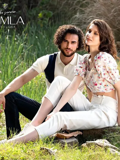 A couple-styled shot for Camla Barcelona's "Boho Summer" campaign. The looks are coordinated in a fresh white and navy palette, creating a romantic and aspirational image for the brand.