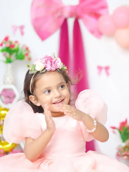 Turning three in style! Milestone birthdays are such a joy to photograph. I love creating vibrant, fun setups with balloons and props that perfectly match your little one's personality.
