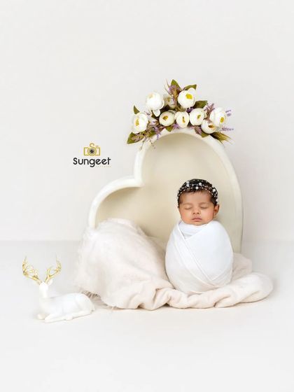 A classic potato sack pose in our heart-shaped bowl. This pose is perfect for showing off a newborn's sweet, curled-up form in a simple and beautiful way.