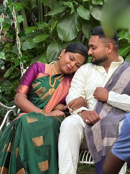 A quiet, tender moment captured during the shoot. Her traditional look is complete with flawless makeup and hair, making her look absolutely serene.