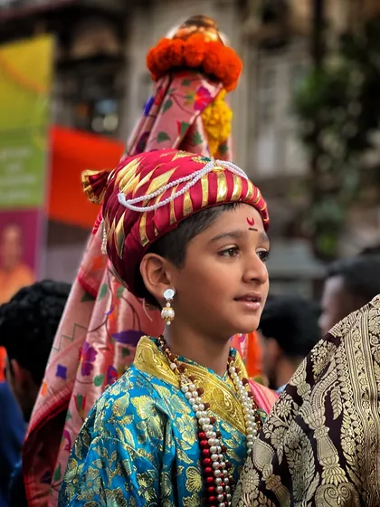 A young participant at the Gudi Padwa procession, carrying the Gudi. This shot captures the innocence and seriousness with which our traditions are upheld.