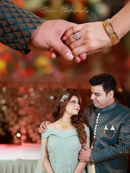 A creative composition with a close-up of the couple holding hands overlaid on their portrait.
