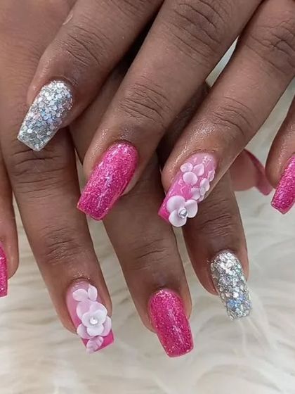 Another angle of the pink and silver glitter extensions with 3D flowers, perfect for a party.