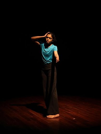 A dancer strikes a pose during a tech run.
