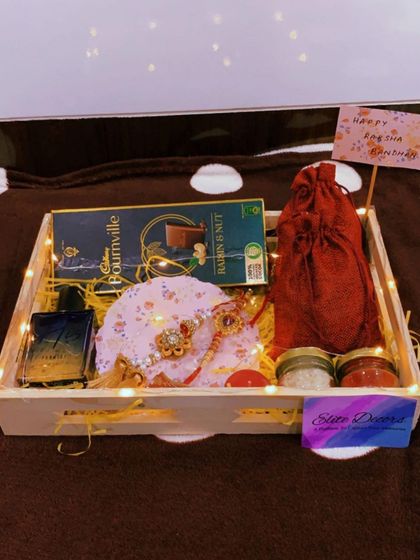A full view of the classic Rakhi hamper for a brother, complete with a handwritten note. Every detail is arranged to create a warm and heartfelt gift.