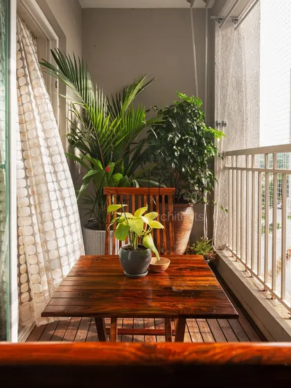A small apartment balcony can be a personal retreat. Here, I used wooden flooring, a compact furniture set, and a curated selection of plants to create a cozy, green corner in the middle of the city.