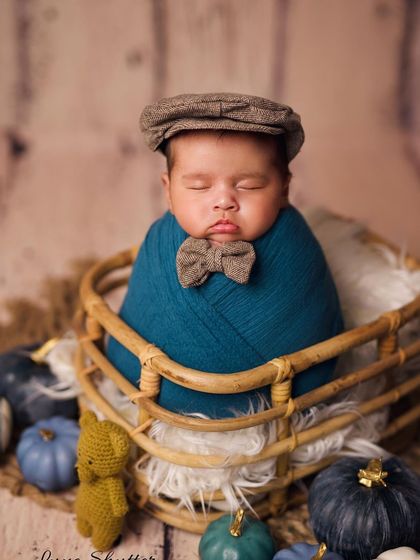 Adding a touch of personality with a newsboy cap and bowtie. This portrait shows how small accessories can create a completely different character for the shoot.