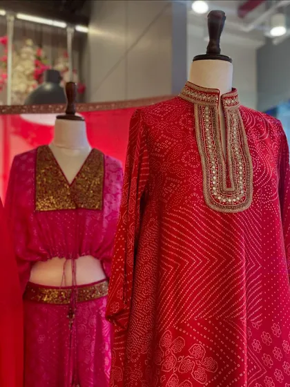 A close-up of the Punit Balana collection, focusing on a men's bandhani kurta and a women's crop top, showcasing options for both him and her.