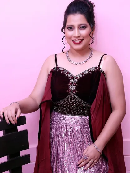 A confident portrait. The makeup is designed to photograph beautifully, with a flawless finish and colors that pop.