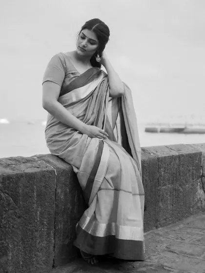 The same portrait, converted to black and white. Stripping away color helps focus on expression, mood, and the timeless quality of the moment. This is a powerful choice for creating classic, elegant portraits during a pre-wedding or solo shoot.