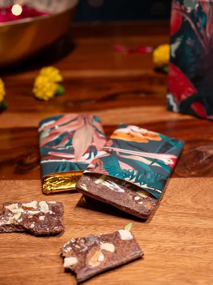 The handmade nut-filled chocolates included in my gift boxes are a delicious treat. I believe a good gift should indulge all the senses, and these artisanal sweets are the perfect complement to a living terrarium.
