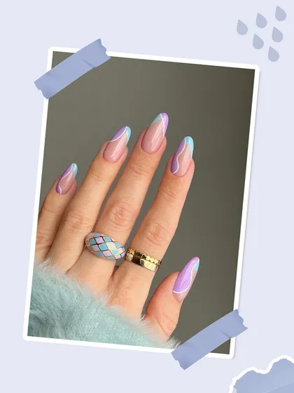 This design features a negative space look with swirls of pastel purple and blue. It's a trendy and modern nail art style that feels both fresh and sophisticated.