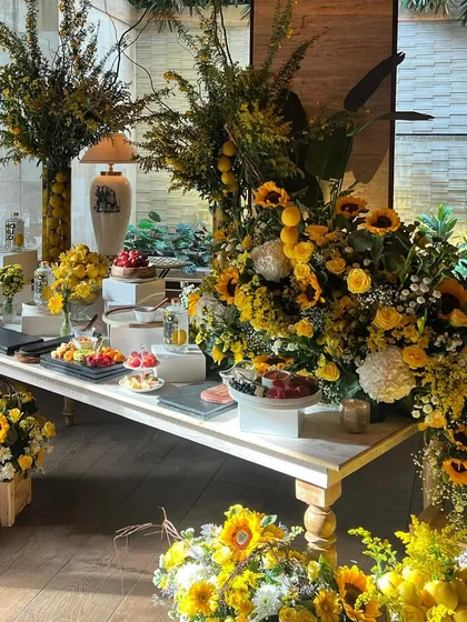 I believe floral design should be joyful and a little playful. For this grazing table, I created a sunshine-filled scene with bright sunflowers and fresh lemons, turning the entire display into a vibrant, sensory experience.
