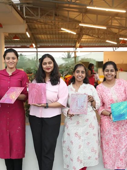 Participants from Setty Mech Engineers showing their beautiful fluid art creations. Each piece is as unique as the person who made it.