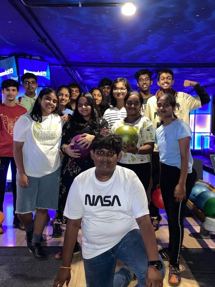 A large group of kids enjoying a day out at our bowling alley.