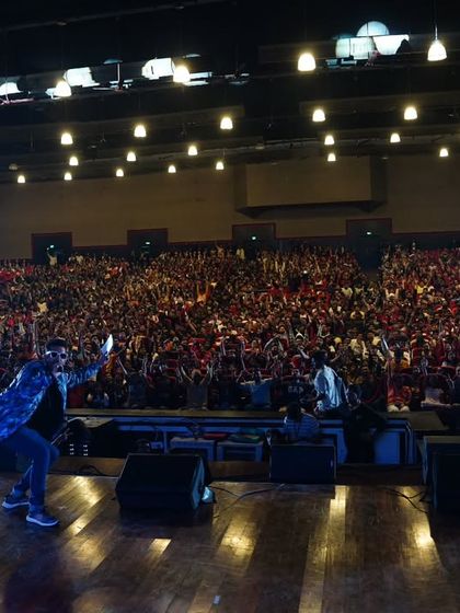 The sea of faces and hands in the air says it all. This is the kind of energy I aim to create at every large-scale college festival I host.