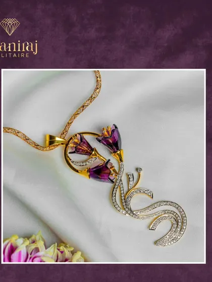 Celebrate life's milestones with jewellery that embodies elegance and strength. This unique pendant features purple floral elements and a swirling diamond base.
