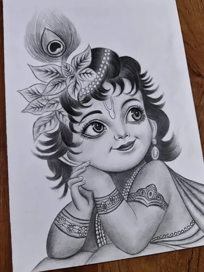 An adorable sketch of Little Krishna, capturing his innocent and divine charm. These drawings are perfect for a child's room or a family prayer space.