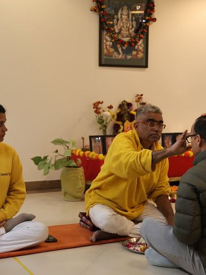 I apply a tilak to a student's forehead during the Diksha ceremony, a symbolic opening of the third eye or seat of wisdom.