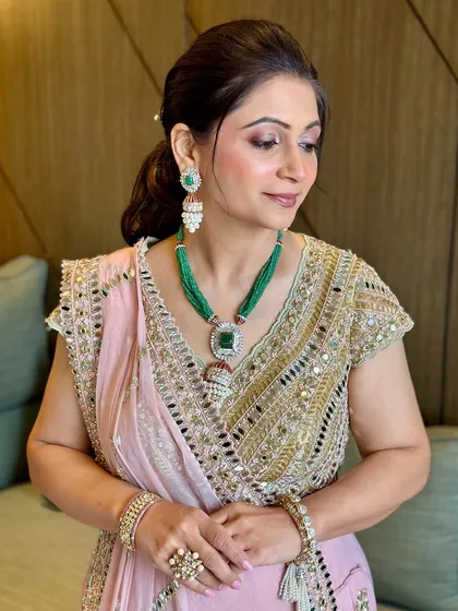 Another beautiful angle of this timeless look. The makeup is designed to look beautiful in any light, ensuring she looks her best throughout the event.