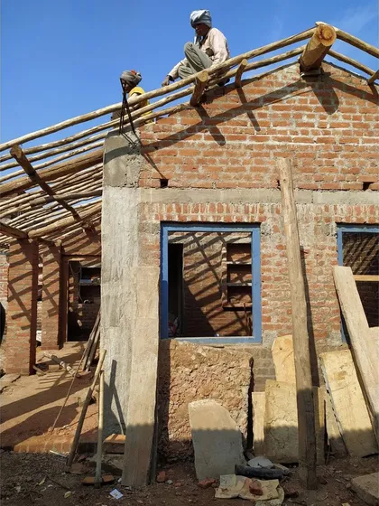 Local craftsmen constructing the roof of an MP Homestay using traditional timber framing techniques. We work closely with artisans to learn from and incorporate their generational knowledge of building with local materials.