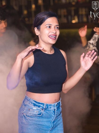 A guest dancing in the smoke-filled atmosphere.