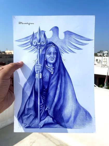 A portrait of Maa Karni of Deshnok, drawn with a blue ballpoint pen. I depicted her with her sacred symbols, the trishul and the eagle, capturing her powerful presence.