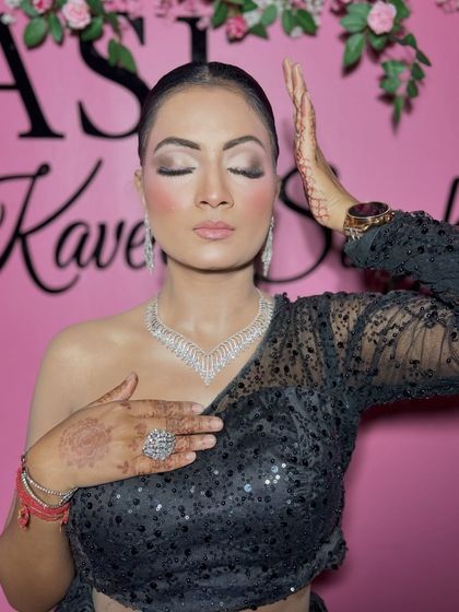 A close-up of the soft glam makeup, with shimmery eyes and a nude lip.