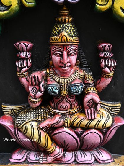 Detail of Dhana Lakshmi from our 72-inch vertical Astalakshmi panel, hand-painted in rich pinks and yellows.