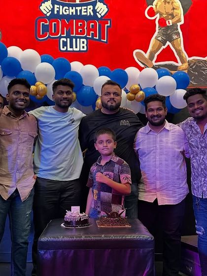 Celebrating a birthday with cake and the team. These moments build the family atmosphere that defines Fighter Combat Club.