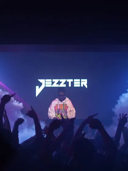 When I'm on stage, I command the room. My setup often includes custom visuals with my name, making it clear who is driving the energy for the night.